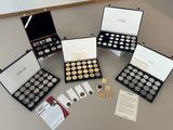 a lot of coins in a case on a table