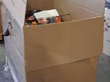 a cardboard box with a bunch of items inside of it