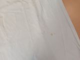 a white t - shirt with a red heart on it