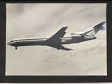 a black and white photo of an airplane flying in the sky