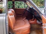 a brown leather seat in the back of a car