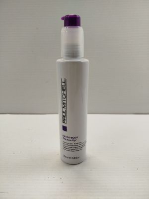 a bottle of paul mitchell ' s hair product sitting on a table