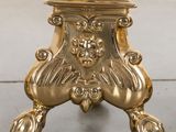 an image of a gold table with a blue top and a gold base