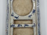 an image of a blue and white plate with a picture frame on it