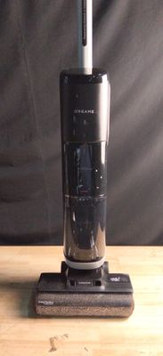 a vacuum that is sitting on a wooden table
