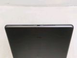 the back of a laptop computer sitting on top of a white surface