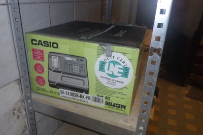 a box that is sitting on a shelf in a room