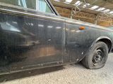 a black car that is parked in a garage