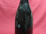 a bottle of wine that is sitting on a table