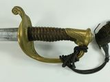 a sword that is on display on a white surface