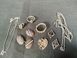 many different pieces of jewelry that are on the table