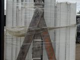 a large stack of white boxes sitting on a pallet