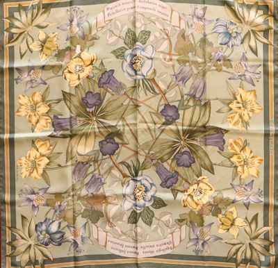a close up of a square scarf with flowers on it