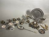 a lot of silver objects that are on the table