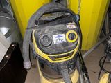 a yellow machine that is sitting in a room