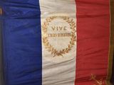 an image of a large french flag hanging on a wall