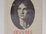 an old book with a picture of a woman in a black and white photo