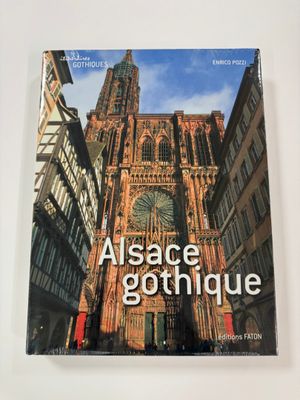 the book is sitting on a table in front of a building