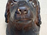 a statue of a dog that is sitting on a table