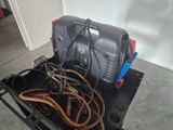 a small air compressor sitting on top of a cart