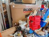 a pile of boxes and other items in a warehouse