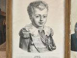 two framed portraits of a boy and a woman in formal clothing