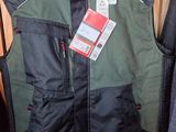 men ' s vests and jackets on display in a store