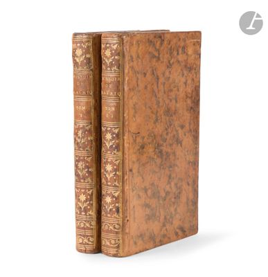 an old book sitting on top of a table next to a white background