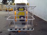 an image of a small machine that is in a parking lot