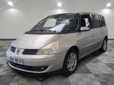 a picture of a silver minivan parked in a room