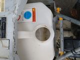 an image of a broken toilet in the middle of the street