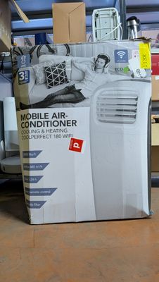 a box of air conditioner sitting on the floor in the garage