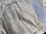 a piece of clothing that is laying on a bed