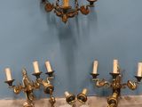 a chandelier that has five lights on each of it