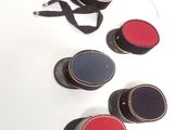 four hats that are sitting on a white surface