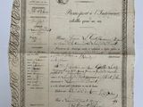 une feuille de papier à laquelle est joint un document