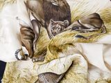 a scarf with a picture of a lion and a cat on it