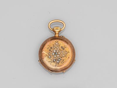 an image of a gold pocket watch with a diamond and enamel dial
