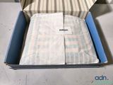 a box with a blanket inside of it on the floor