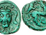 a green coin with a monkey on it and a lion on it