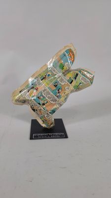 an image of a sculpture of a bird made out of newspaper