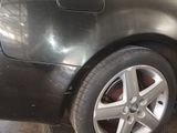 a picture of a car that is parked in a garage