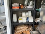 a kitchen with a lot of items on the shelves