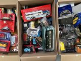two boxes of toy cars and other toys in them
