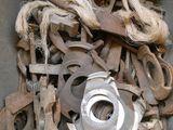 a large pile of old rusty tools in a bin