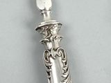 a silver spoon with a spoon handle on it