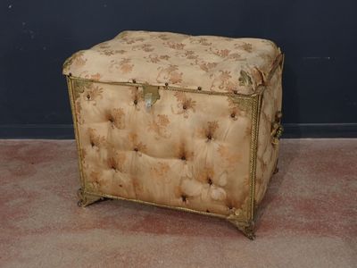 a small ottoman with a floral pattern on it