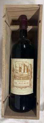 a bottle of wine in a wooden box on a table