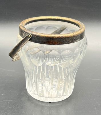 a glass cup with a handle on a table