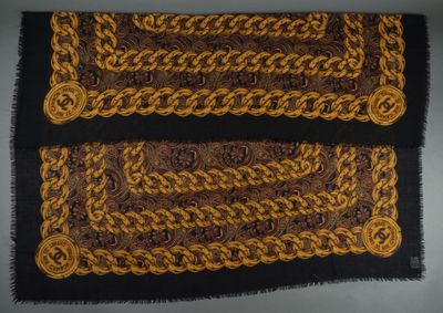 a close up of two brown and black rugs on a table